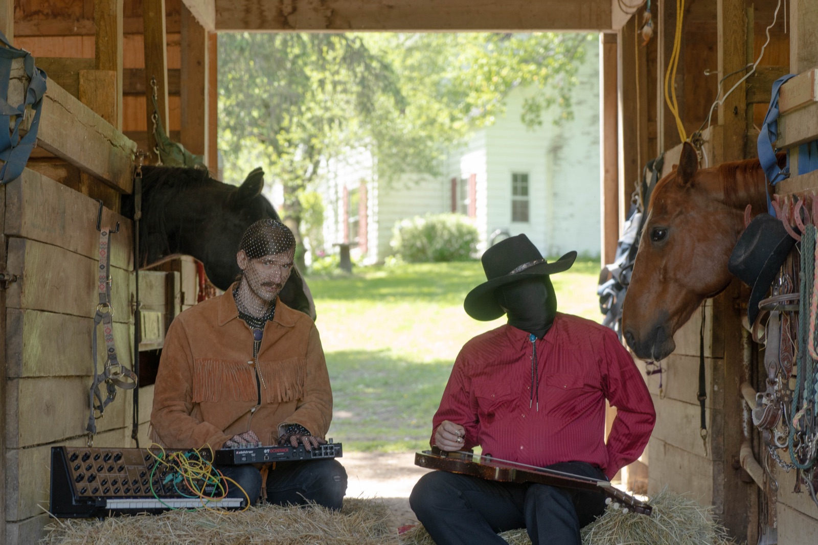 Horses 4k performing in a horse stable — Jacob on pedal steel, Robin on synthesizer, with horses looking on